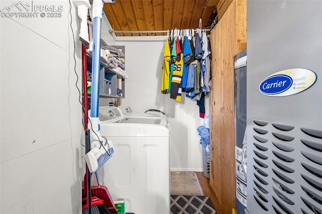 washroom with washing machine and clothes dryer, laundry area, and wooden ceiling