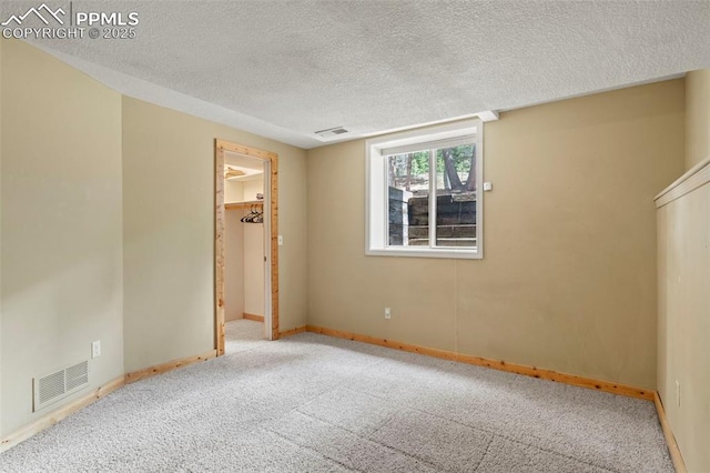 1200 Forest Edge Rd, Woodland Park, CO 80863 - carpeted empty room with a textured ceiling, visible vents, and baseboards