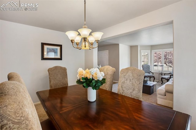 7820 Curlew Ct, Colorado Springs, CO 80920 - dining space with carpet floors and a notable chandelier