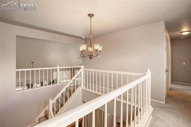 7820 Curlew Ct, Colorado Springs, CO 80920 - stairs featuring carpet floors, baseboards, and a notable chandelier