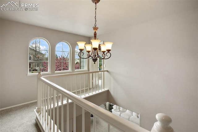 7820 Curlew Ct, Colorado Springs, CO 80920 - stairs featuring baseboards, carpet flooring, and a notable chandelier