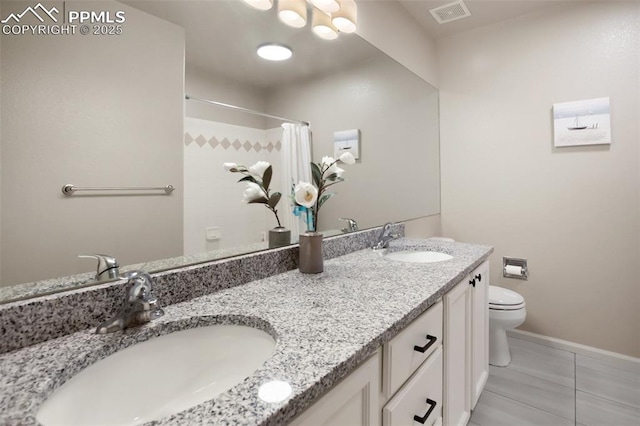7820 Curlew Ct, Colorado Springs, CO 80920 - bathroom featuring visible vents, a sink, tile patterned floors, and toilet