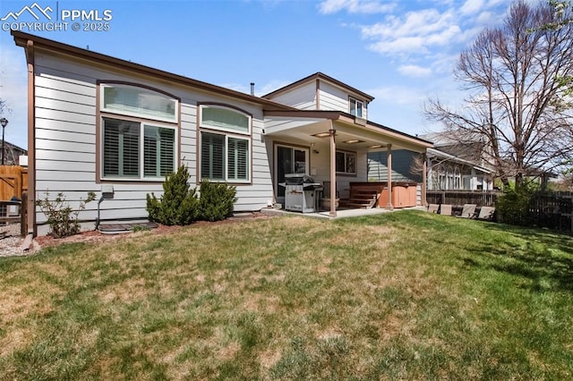 7820 Curlew Ct, Colorado Springs, CO 80920 - rear view of property featuring a hot tub, a yard, fence, and a patio area