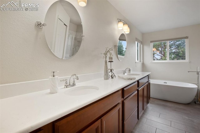 7820 Curlew Ct, Colorado Springs, CO 80920 - bathroom with a sink, a shower, double vanity, and a freestanding bath
