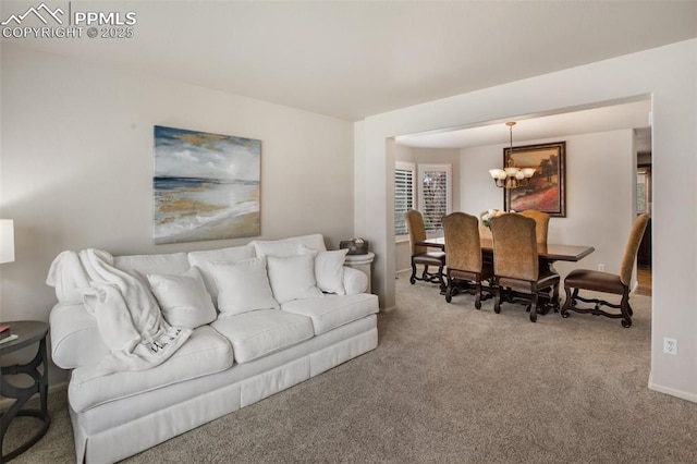 7820 Curlew Ct, Colorado Springs, CO 80920 - carpeted living area with baseboards and an inviting chandelier
