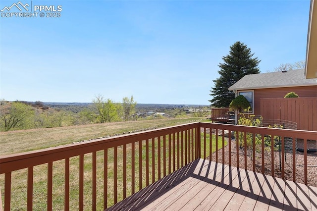 wooden deck with a yard