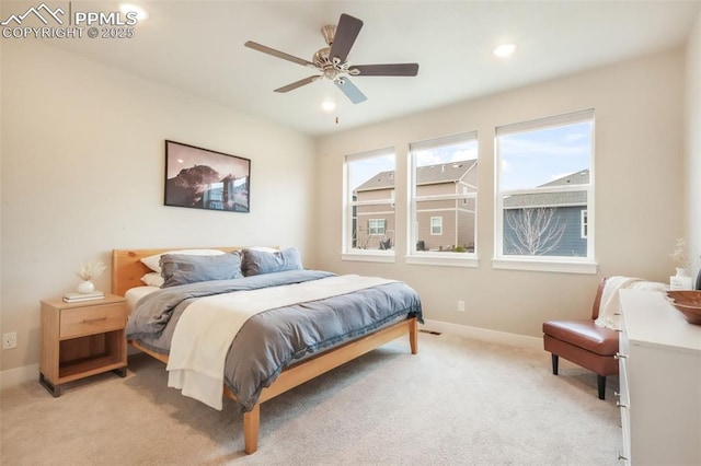 bedroom with recessed lighting, baseboards, and light carpet