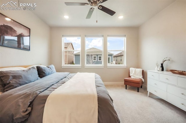 bedroom with light colored carpet, recessed lighting, baseboards, and a ceiling fan