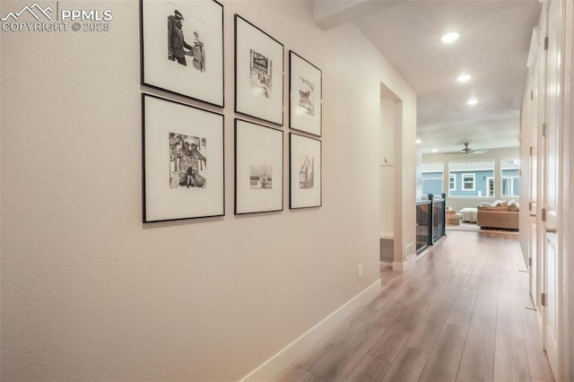 hall with recessed lighting, baseboards, and wood finished floors