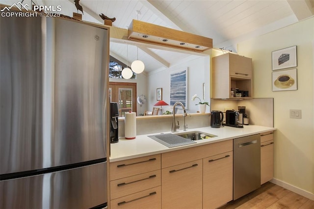 500 W Kellys Rd, Woodland Park, CO 80863 - kitchen with appliances with stainless steel finishes, a sink, light countertops, light wood finished floors, and light brown cabinetry