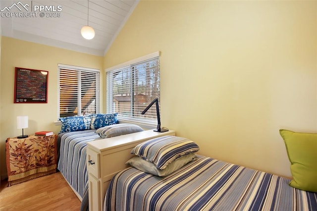 500 W Kellys Rd, Woodland Park, CO 80863 - bedroom with light wood finished floors and high vaulted ceiling