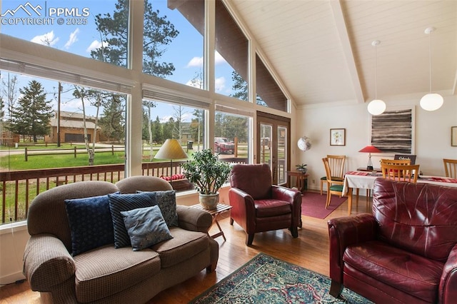 500 W Kellys Rd, Woodland Park, CO 80863 - living room with high vaulted ceiling, wood finished floors, and beamed ceiling