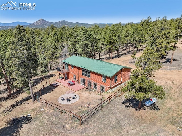 birds eye view of property with a mountain view
