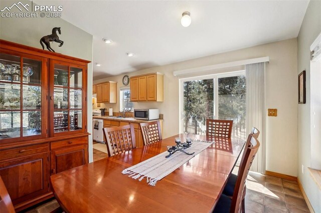 dining area featuring recessed lighting and baseboards