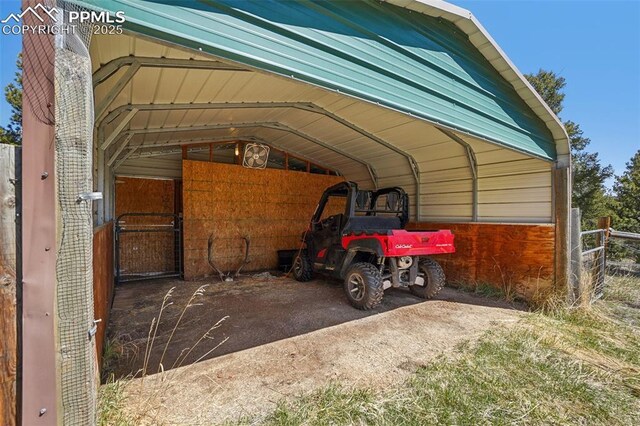 view of vehicle parking with a detached carport