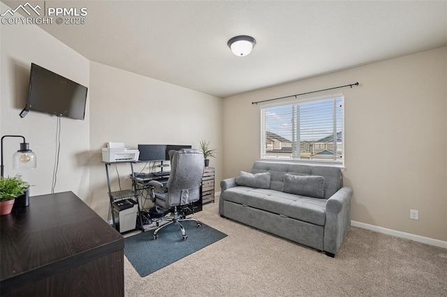 carpeted home office with baseboards