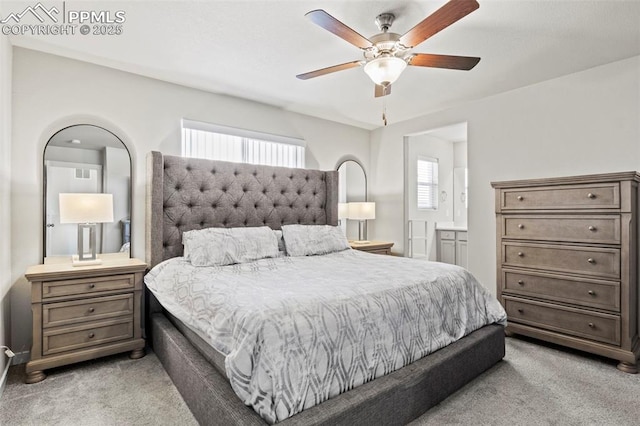 bedroom featuring light colored carpet and ceiling fan