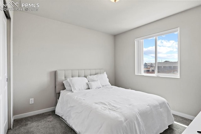 carpeted bedroom with baseboards