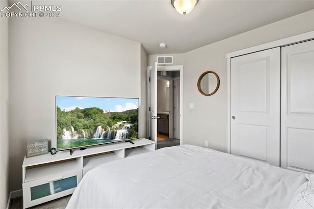 bedroom with visible vents and a closet