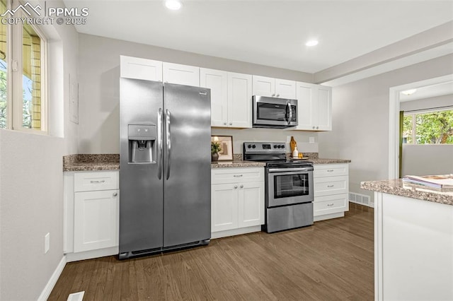 kitchen featuring baseboards, dark wood-style floors, recessed lighting, white cabinetry, and appliances with stainless steel finishes