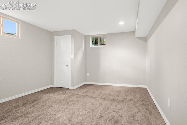 basement with recessed lighting, baseboards, and carpet