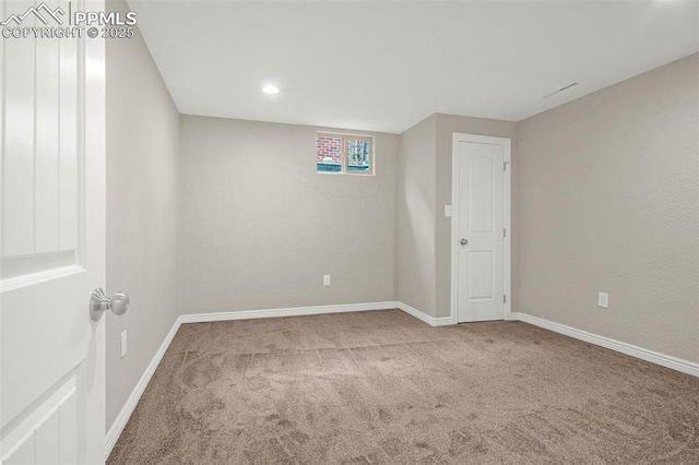 unfurnished room featuring carpet floors, baseboards, and recessed lighting