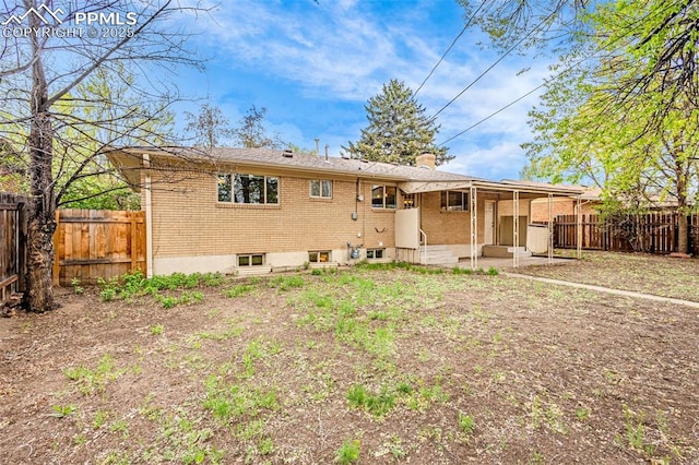 ranch-style home with a fenced backyard, a patio, and brick siding