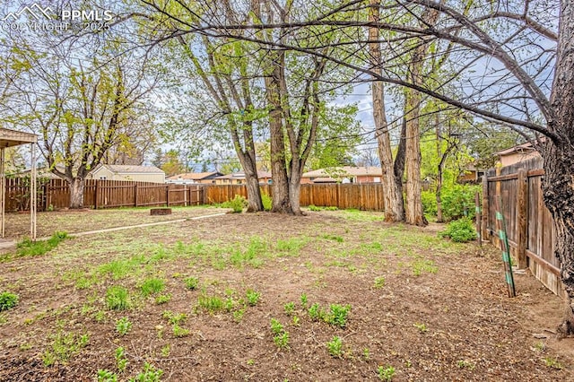 view of yard with a fenced backyard