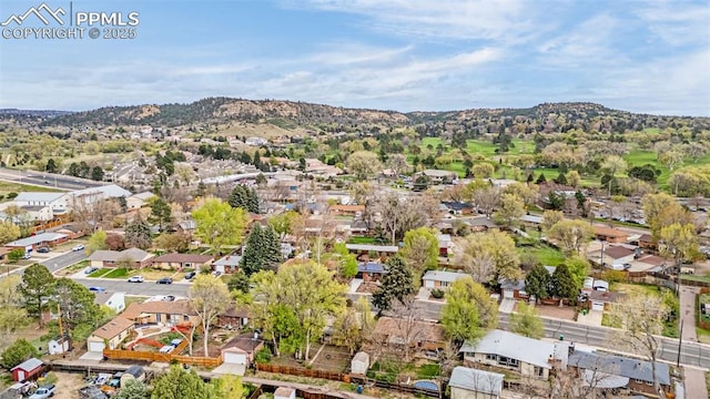 birds eye view of property with a mountain view and a residential view