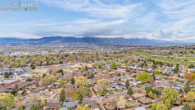 drone / aerial view featuring a residential view and a mountain view