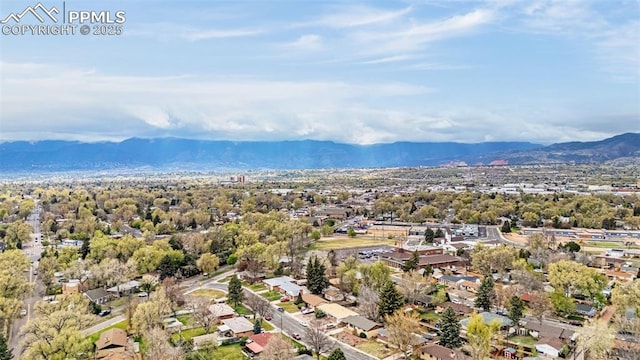 birds eye view of property with a mountain view