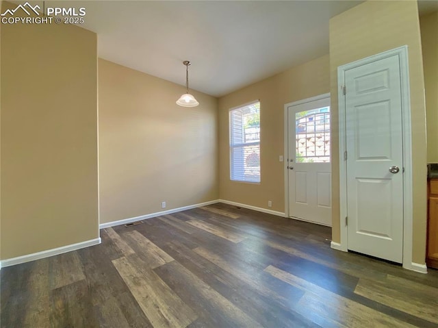 2748 Scotchbroom Pt, Colorado Springs, CO 80910 - interior space with baseboards, visible vents, and dark wood-style flooring