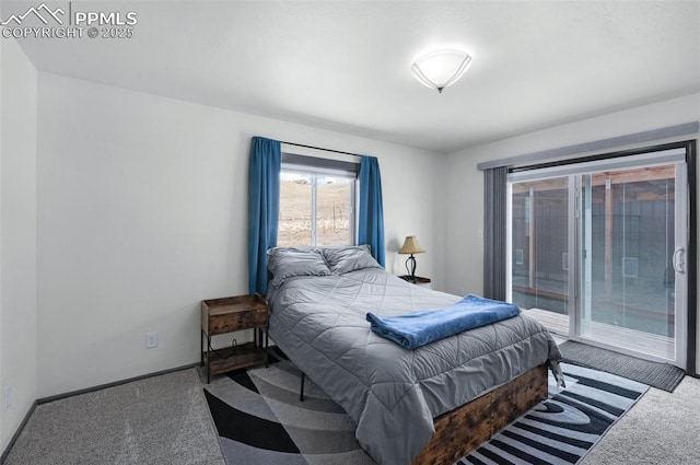 bedroom with carpet floors, baseboards, and access to outside
