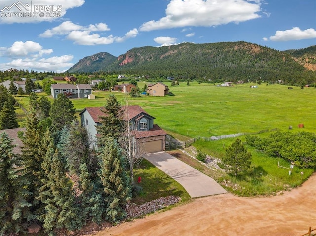 133 Wheat Ridge St, Palmer Lake, CO 80133 - view of mountain backdrop featuring nearby suburban area