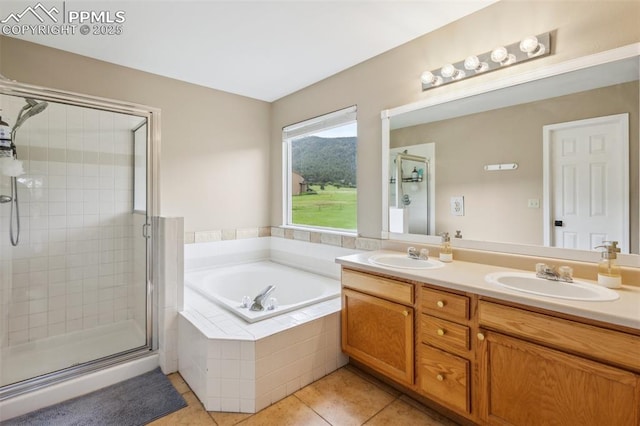 133 Wheat Ridge St, Palmer Lake, CO 80133 - full bathroom featuring tile patterned flooring, a shower stall, double vanity, and a garden tub