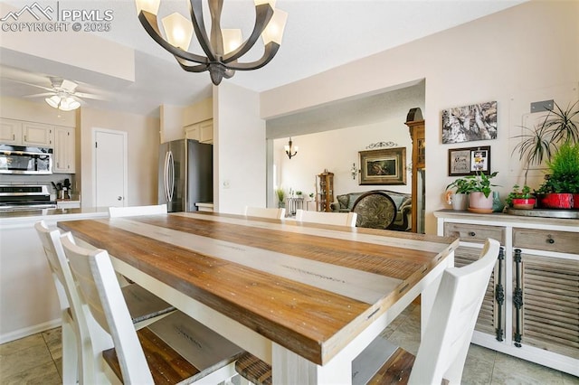 dining space featuring ceiling fan with notable chandelier and light tile patterned floors