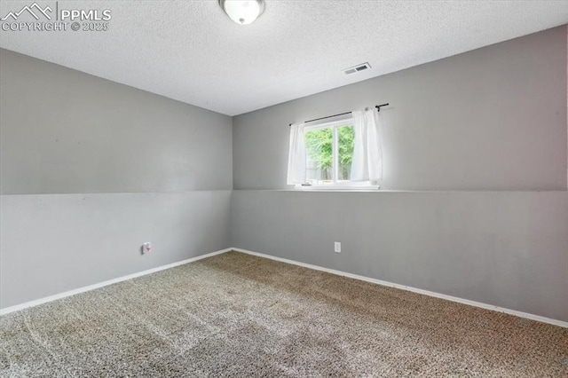 2032 Woodsong Way, Fountain, CO 80817 - unfurnished room with carpet flooring, a textured ceiling, and baseboards