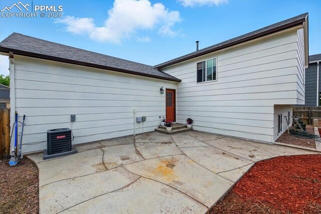 2032 Woodsong Way, Fountain, CO 80817 - rear view of house featuring cooling unit and a patio
