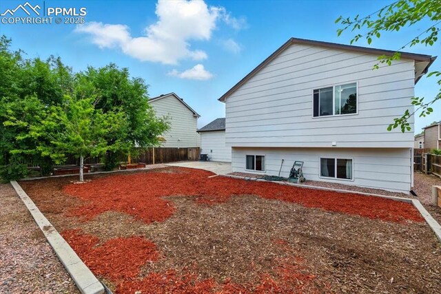 2032 Woodsong Way, Fountain, CO 80817 - back of property with a fenced backyard and a patio