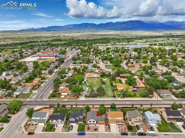 2032 Woodsong Way, Fountain, CO 80817 - aerial perspective of suburban area featuring a mountainous background