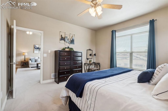 8492 Artesian Springs Pt, Colorado Springs, CO 80920 - bedroom featuring light carpet, ceiling fan, and baseboards
