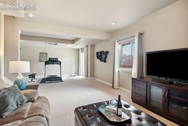 8492 Artesian Springs Pt, Colorado Springs, CO 80920 - living area featuring light carpet and baseboards