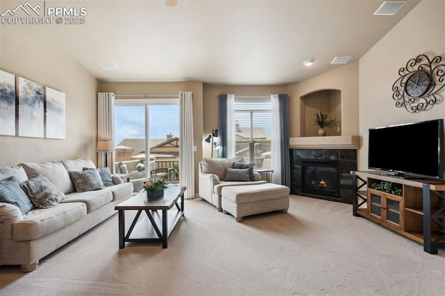 8492 Artesian Springs Pt, Colorado Springs, CO 80920 - carpeted living area featuring a tiled fireplace