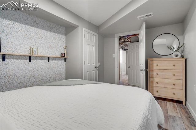 720 S Prospect St, Colorado Springs, CO 80903 - bedroom with wood finished floors, visible vents, and baseboards