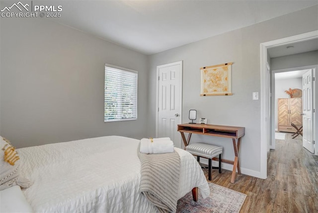 720 S Prospect St, Colorado Springs, CO 80903 - bedroom with wood finished floors and baseboards