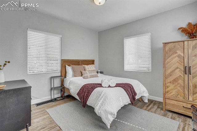 720 S Prospect St, Colorado Springs, CO 80903 - bedroom featuring wood finished floors, visible vents, and baseboards