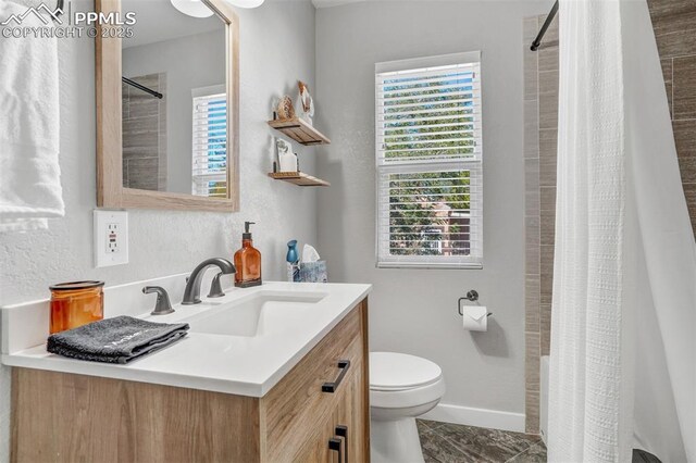 720 S Prospect St, Colorado Springs, CO 80903 - bathroom with curtained shower, toilet, vanity, and baseboards