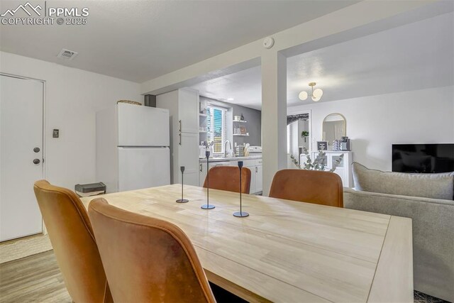 720 S Prospect St, Colorado Springs, CO 80903 - dining area featuring visible vents and wood finished floors