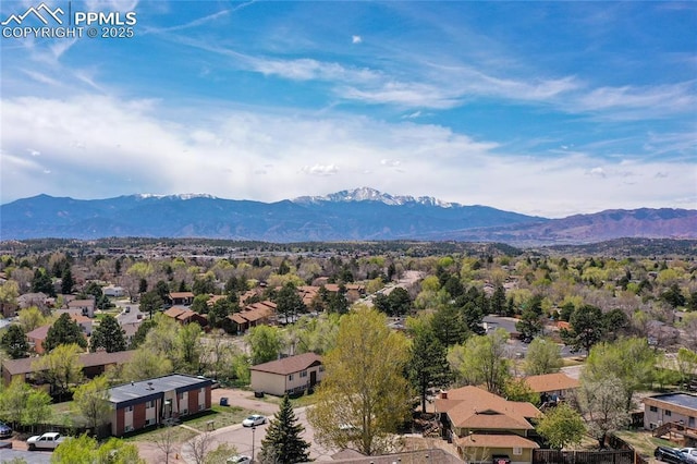 aerial view of residential area featuring a mountain backdrop
