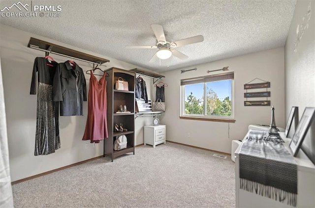 9025 Rochester Dr, Colorado Springs, CO 80920 - spacious closet featuring a ceiling fan and light colored carpet